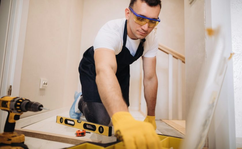 Maintenance man fixing a new floor